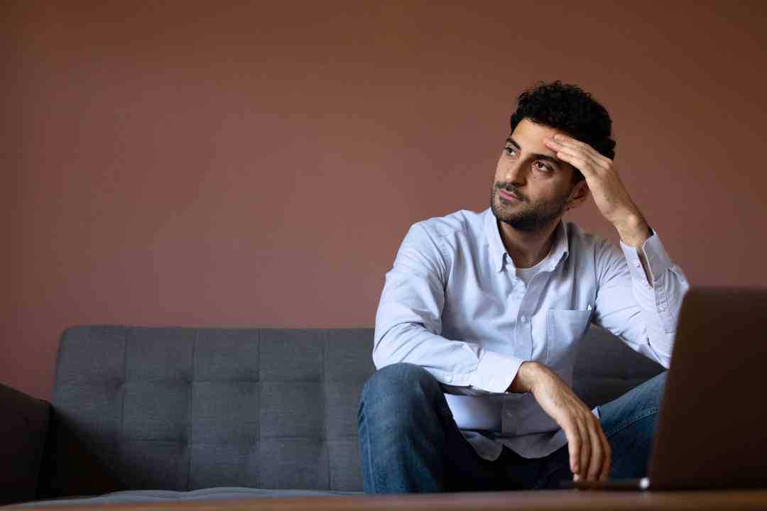 Property owner frustrated while tracking project updates manually, representing challenges faced before using IntoAEC project management software.