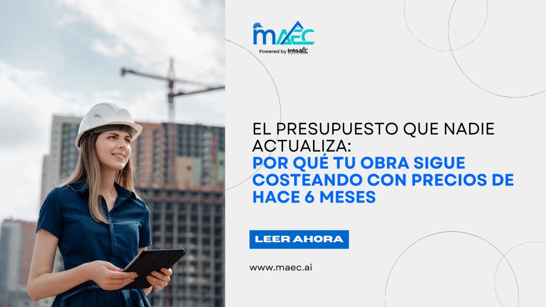 Ingeniera con casco de seguridad revisa una tablet frente a un edificio en construcción — blog de MAEC sobre por qué los presupuestos de obra no se actualizan